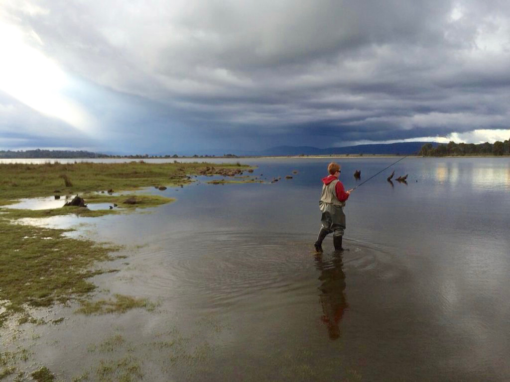 My twelve year old strides into a storm in pursuit of a fish. Bronte Lagoon Tasmania.